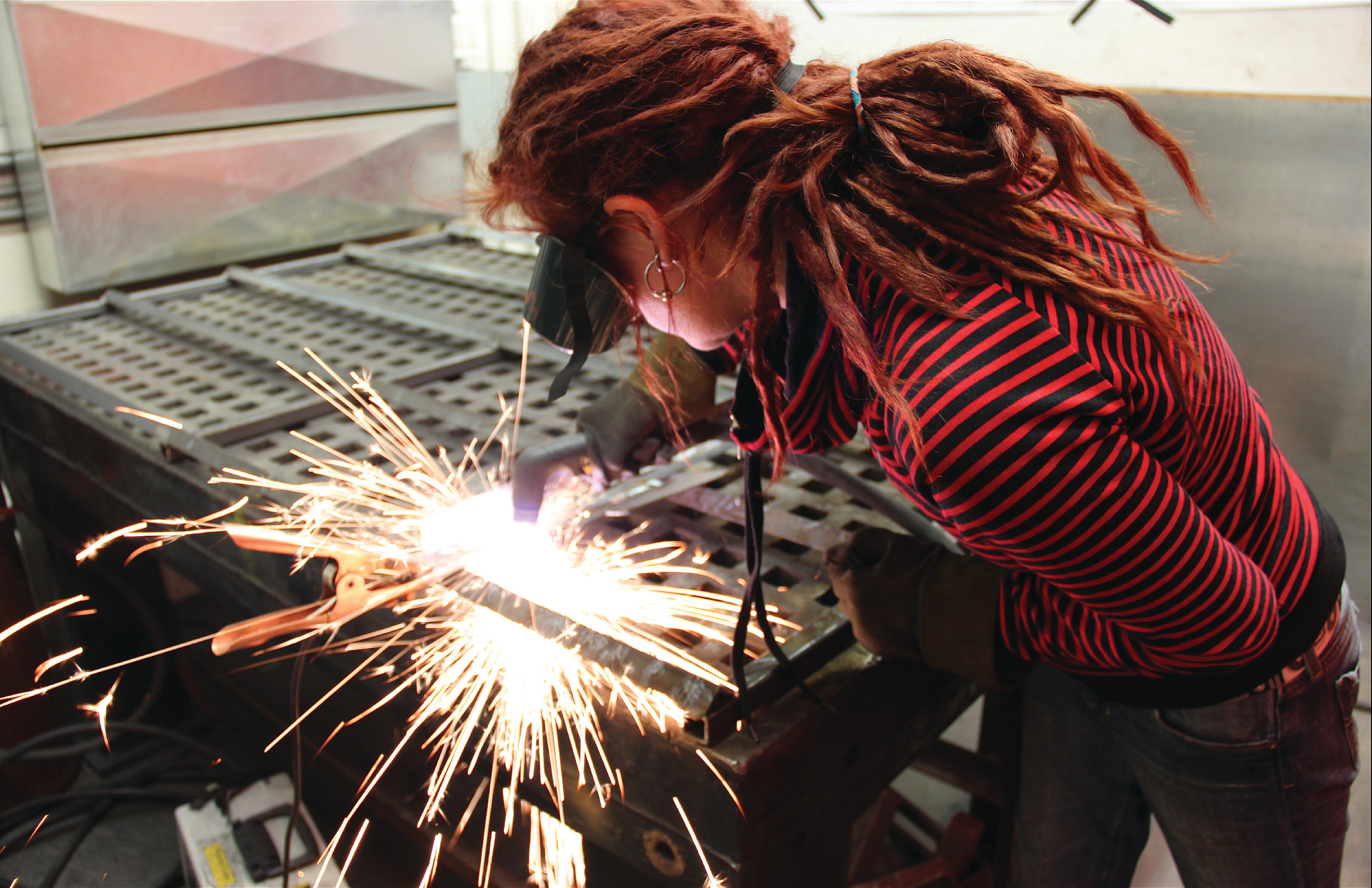 Using the plasma cutter at the Artisan's Asylum makerspace in Somerville, Massachusetts